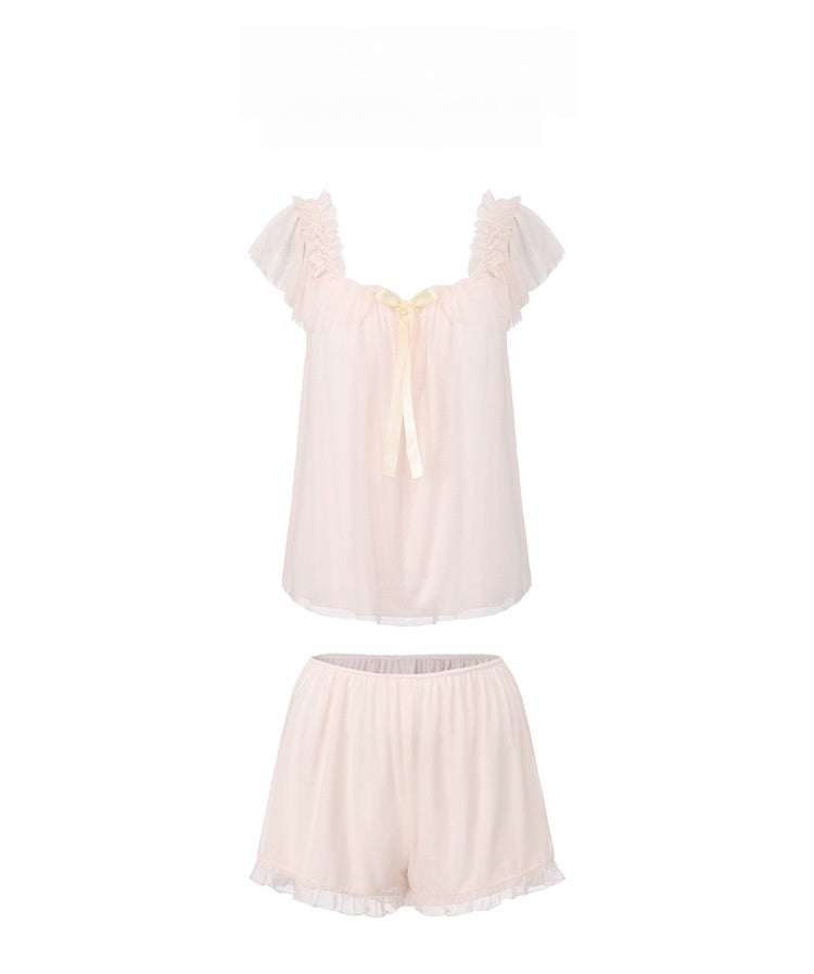 Two-piece set featuring a sexy, sheer mesh, low-cut solid-color top and shorts.