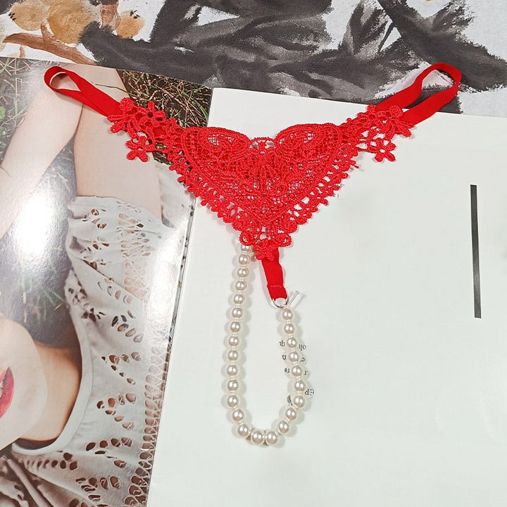 Highly elastic, openwork embroidered lace thong with massage benefits.