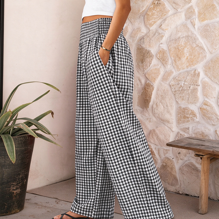 High-waisted, wide-leg plaid trousers—a stylish choice