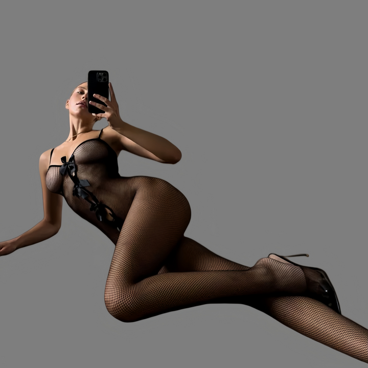 Trendy fishnet bodysuit with a sexy bow.