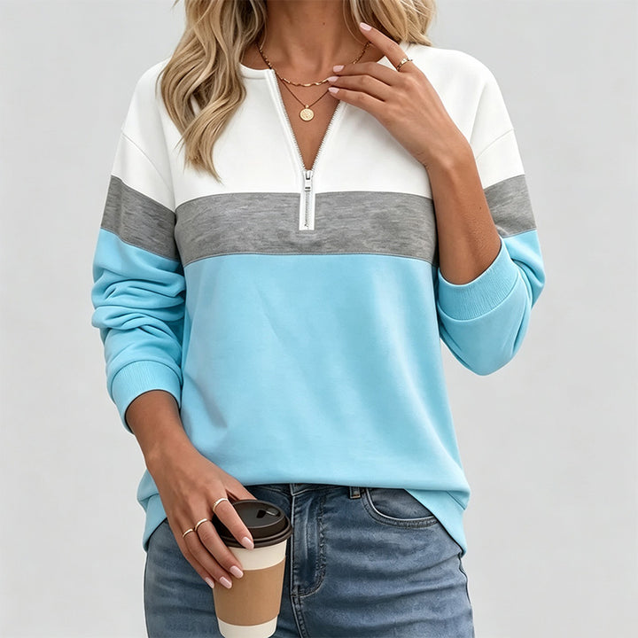 Half-zip long-sleeve sweatshirt—loose fit that flatters the figure