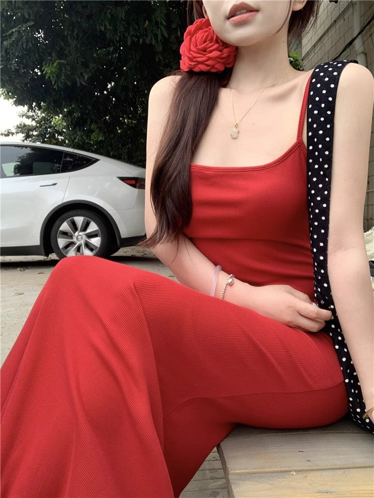 An elegant, fitted, backless dress; a long, form-fitting skirt.