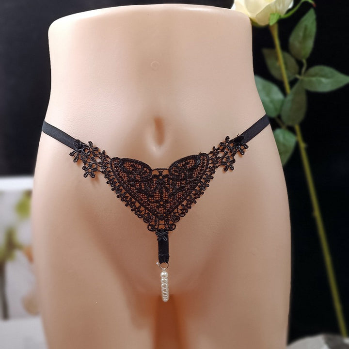 Highly elastic, openwork embroidered lace thong with massage benefits.