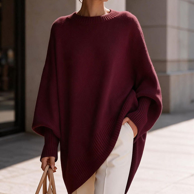 Loose-fitting, solid-color, crew-neck knit top for autumn and winter.