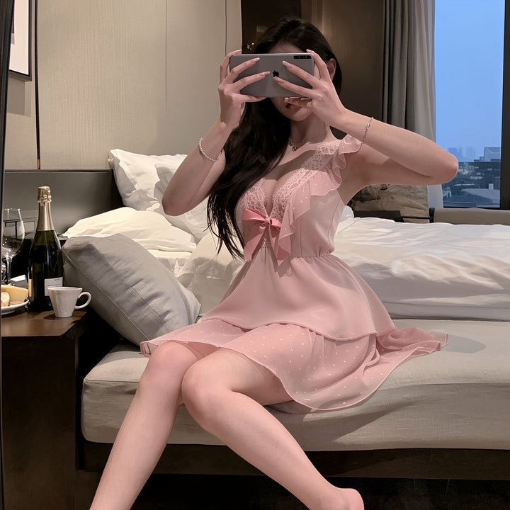 Satin and polka-dot mesh babydoll dress with sweet bow detail.