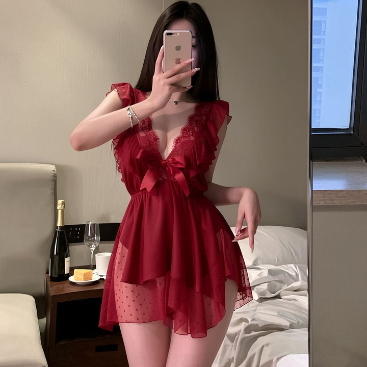 Satin and polka-dot mesh babydoll dress with sweet bow detail.