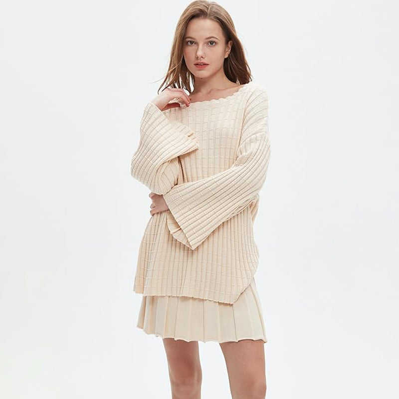 Relaxed-fit two-piece set: long-sleeved knit top and pleated skirt.