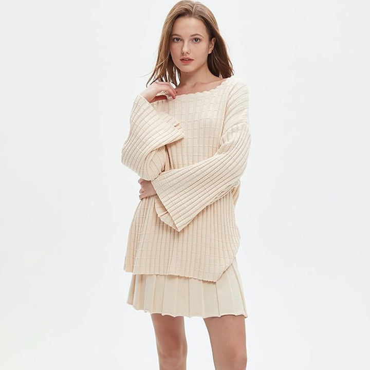 Relaxed-fit two-piece set: long-sleeved knit top and pleated skirt.