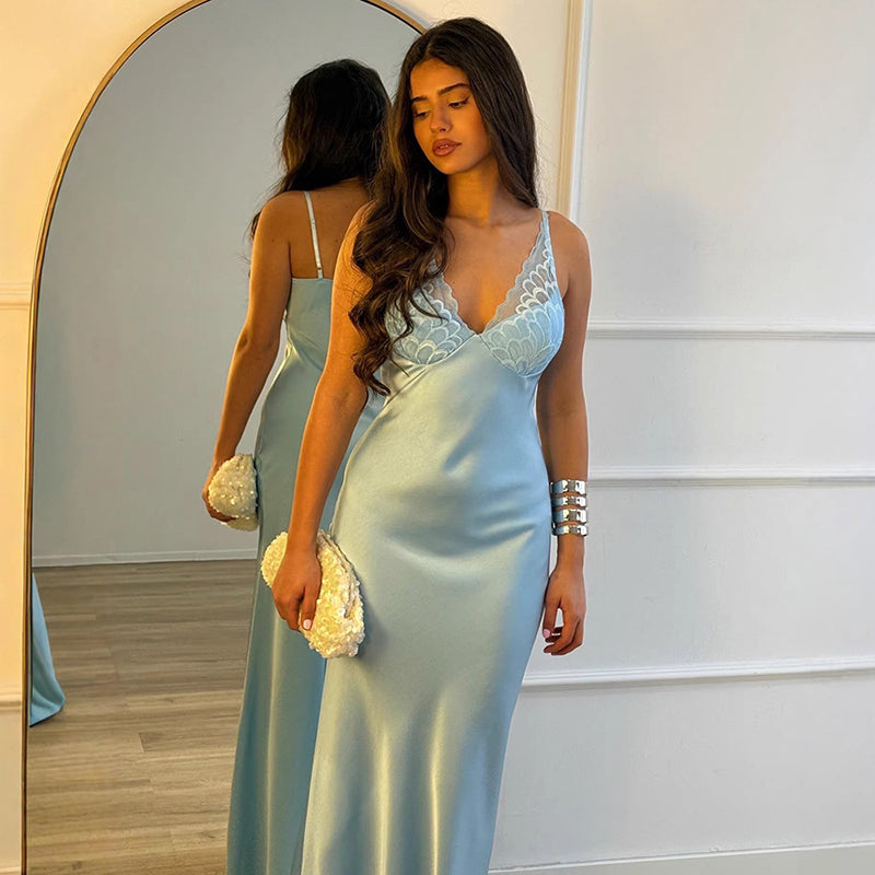 A new satin slip dress featuring lace paneling and a fluid drape.