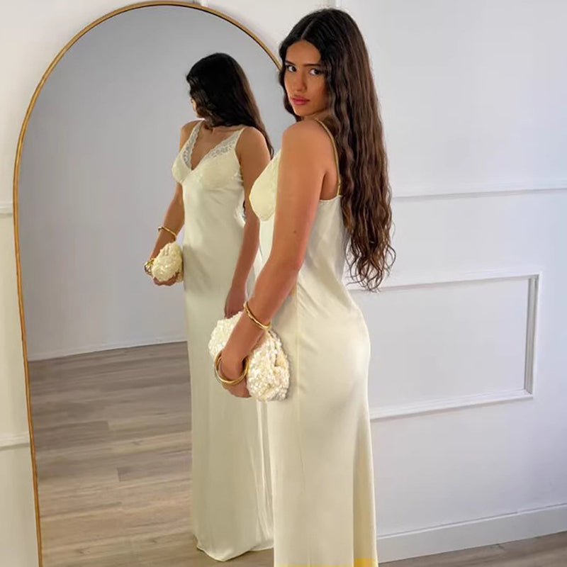 A new satin slip dress featuring lace paneling and a fluid drape.