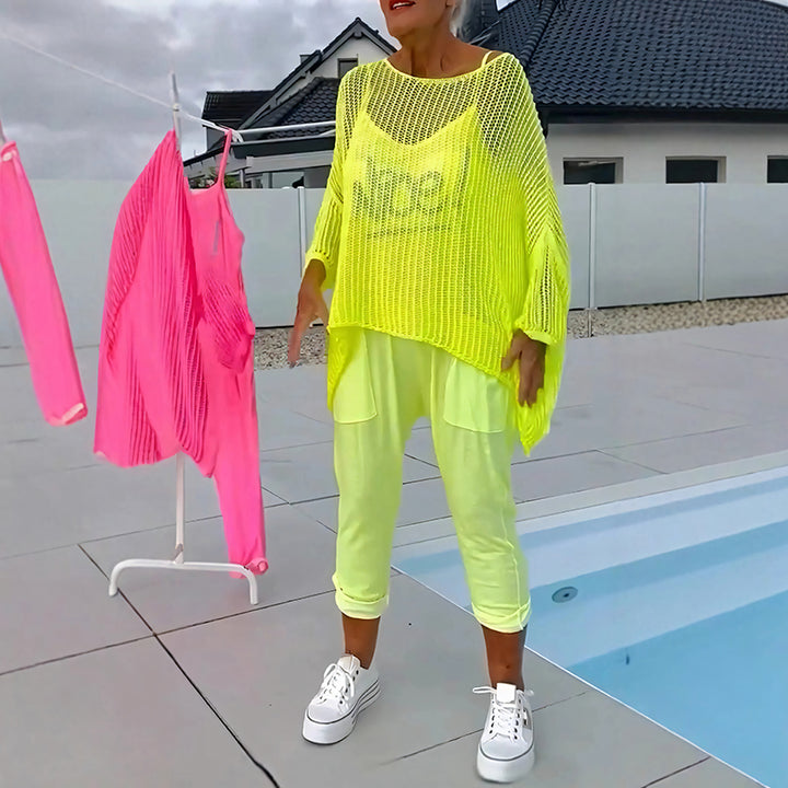 Two-piece set featuring a loose-fitting knit top and a jumpsuit.