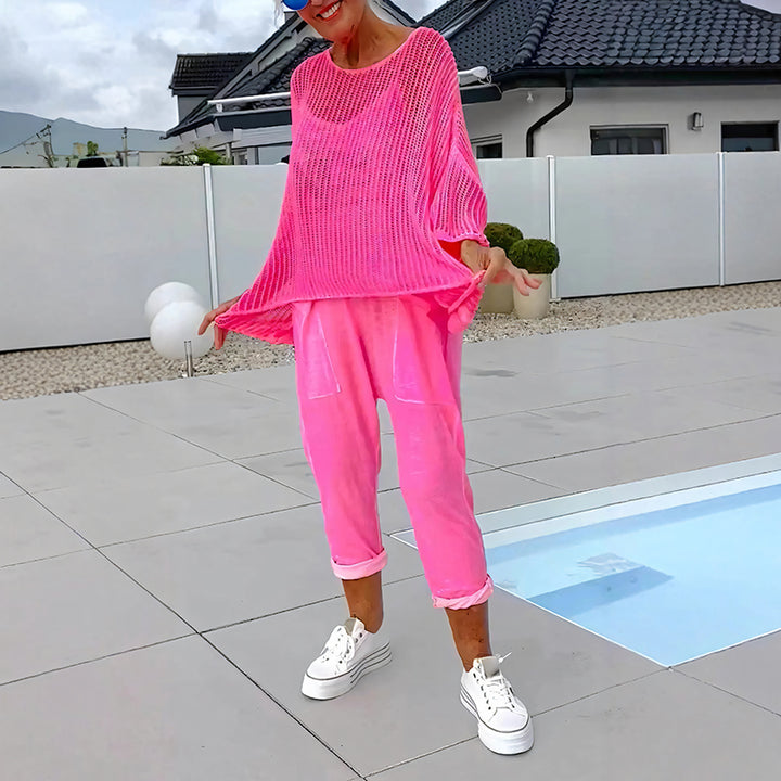 Two-piece set featuring a loose-fitting knit top and a jumpsuit.