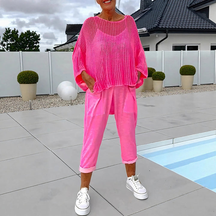Two-piece set featuring a loose-fitting knit top and a jumpsuit.